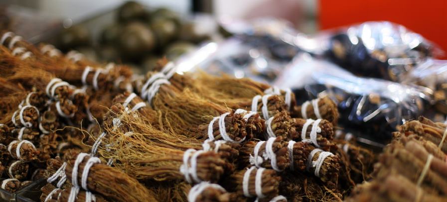 Chinese herbs being sold at an outdoor market.